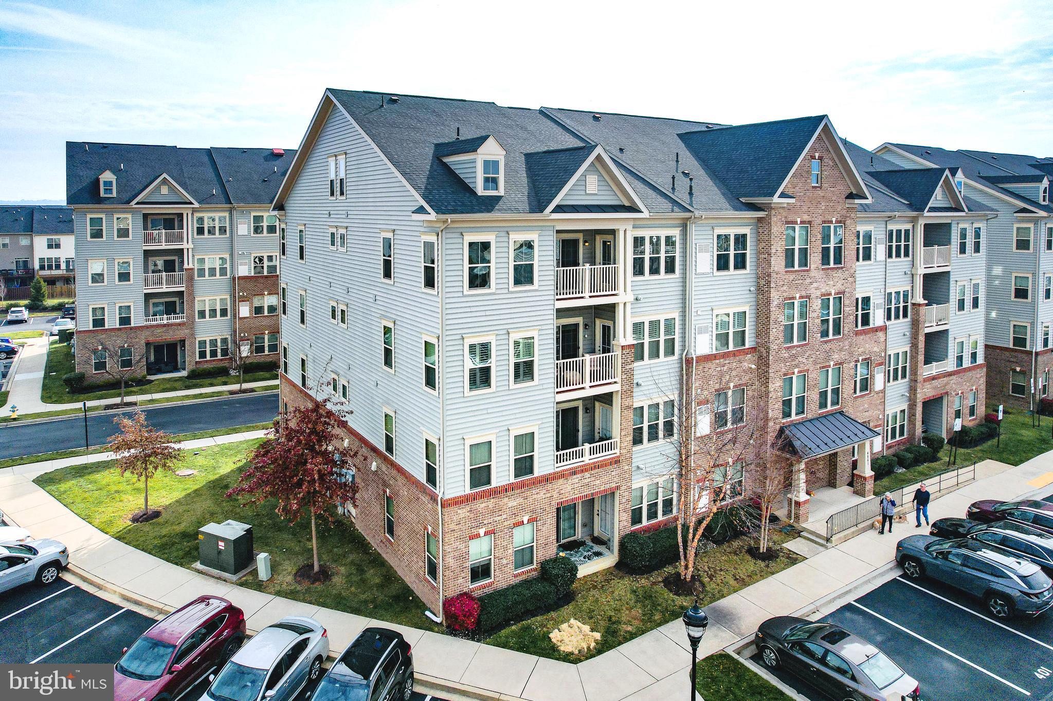 4861 Finnical Way, Unit 401 Frederick, MD 21703 - Photo 47 of 53 a front view of a building with street view