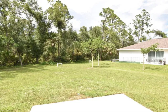 a view of a swimming pool with an outdoor space and seating area