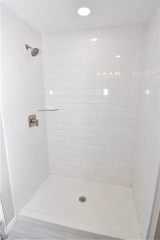 a bathroom with a shower and bathtub