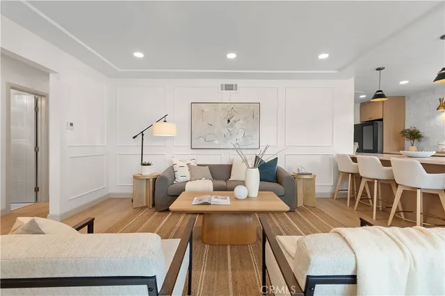 a living room with furniture and a table