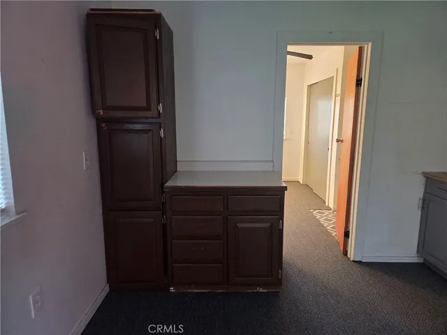 a view of a field with an trees