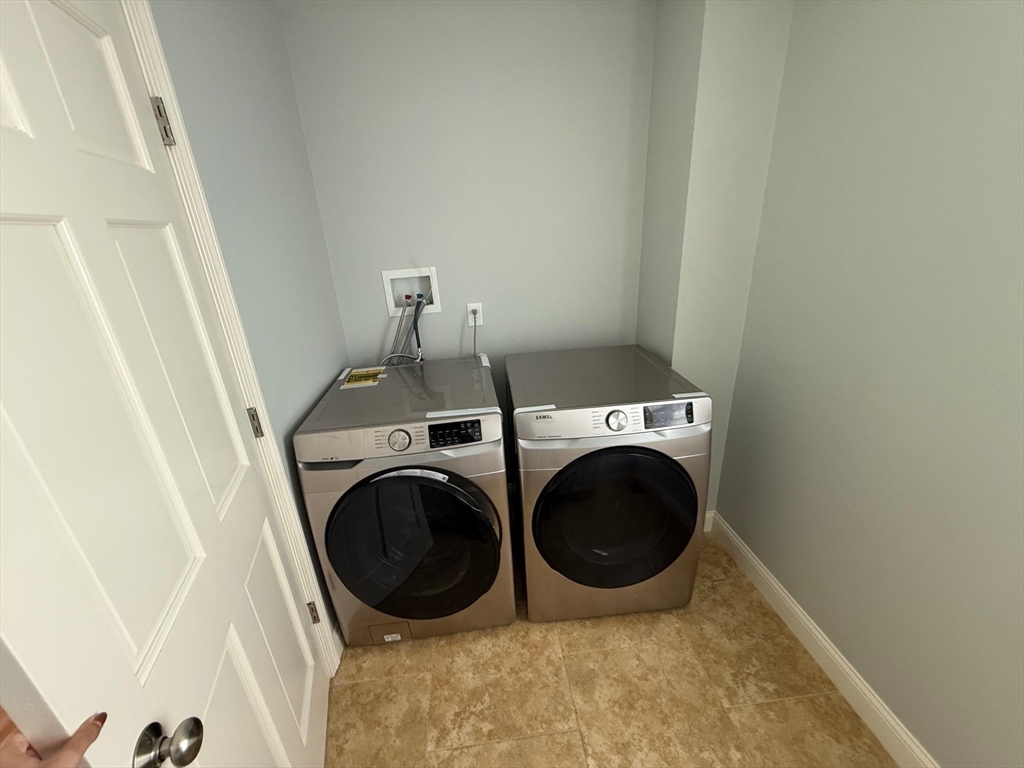 15 Spencer Street Methuen, MA 01844 - Photo 20 of 25 a utility room with dryer and washer