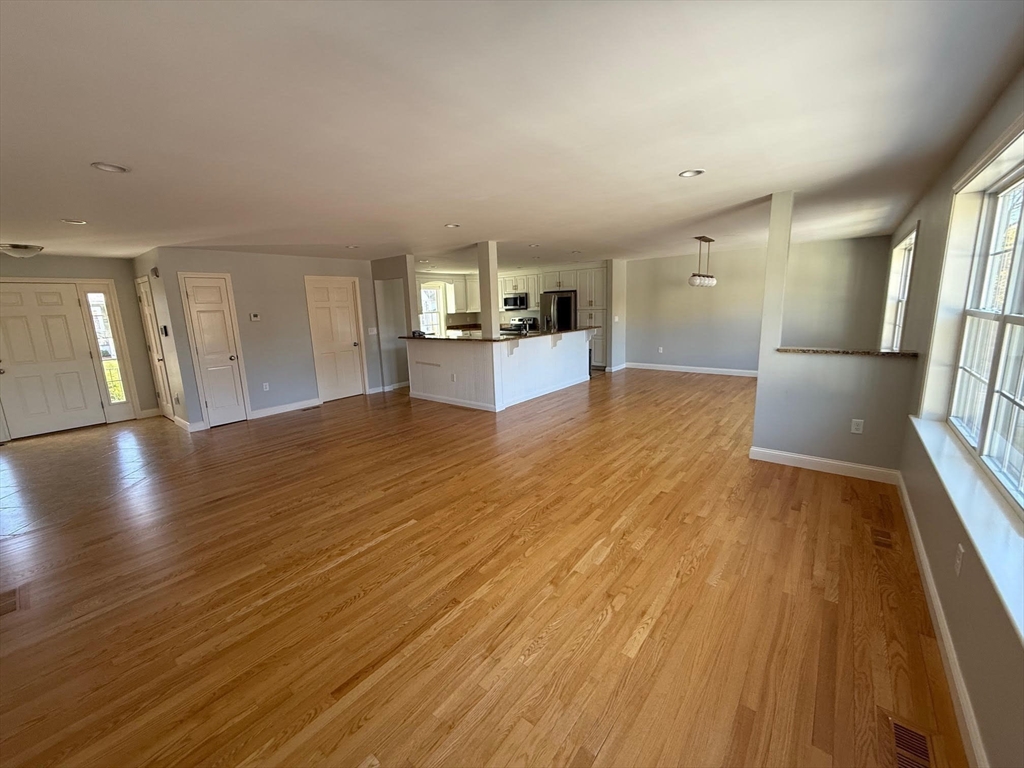 15 Spencer Street Methuen, MA 01844 - Photo 22 of 25 a view of a kitchen with a sink and dishwasher wooden floor
