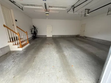 a view of a hallway with stairs