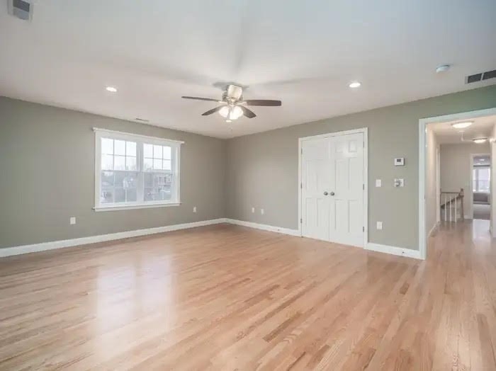 15 Spencer Street Methuen, MA 01844 - Photo 10 of 25 a view of an empty room with wooden floor and a window