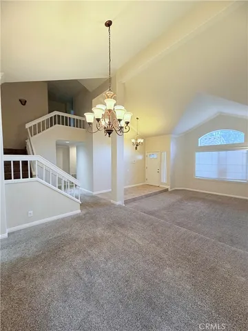 a view of a bedroom with a chandelier