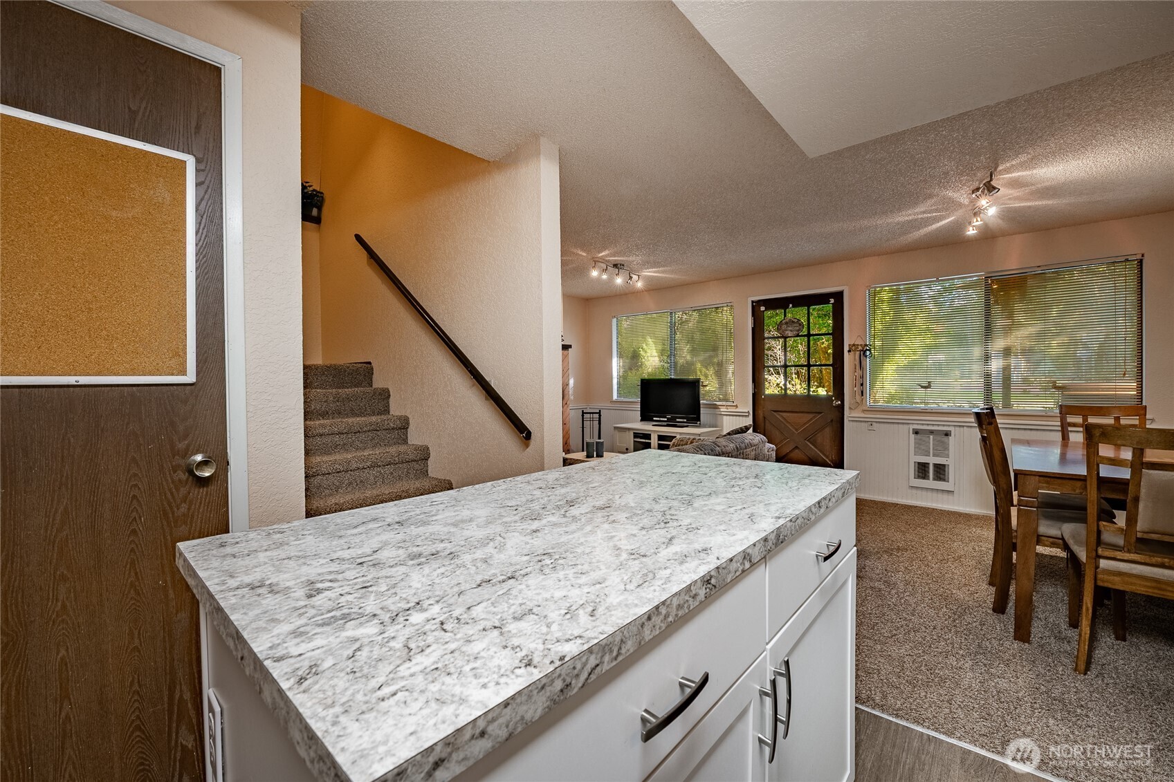 7018 Olympus Way Glacier, WA 98244 - Photo 11 of 35 a view of kitchen island and wooden floor