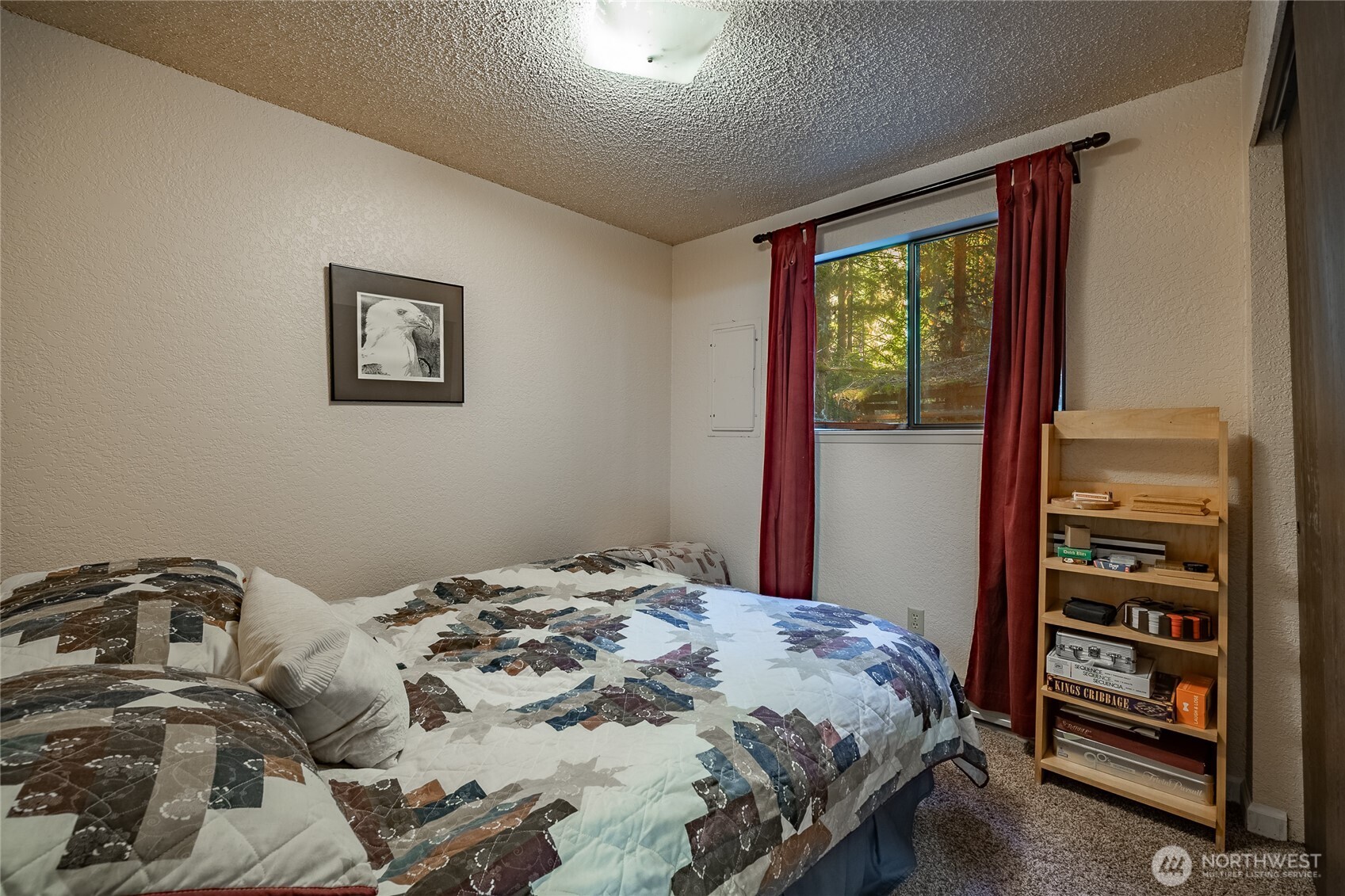 7018 Olympus Way Glacier, WA 98244 - Photo 12 of 35 a bedroom with a bed and a wall painting