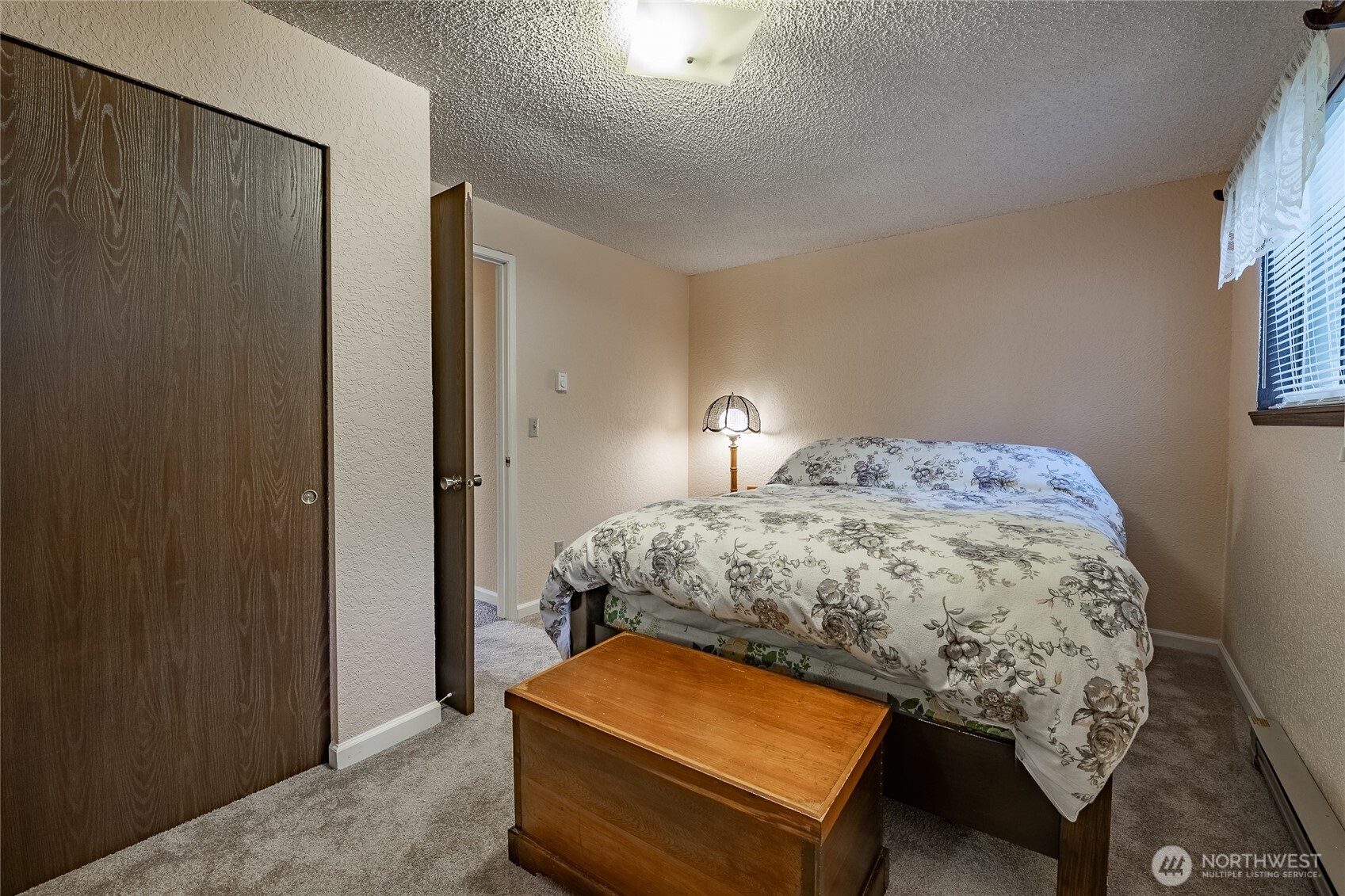 7018 Olympus Way Glacier, WA 98244 - Photo 17 of 35 a bedroom with a bed and a window