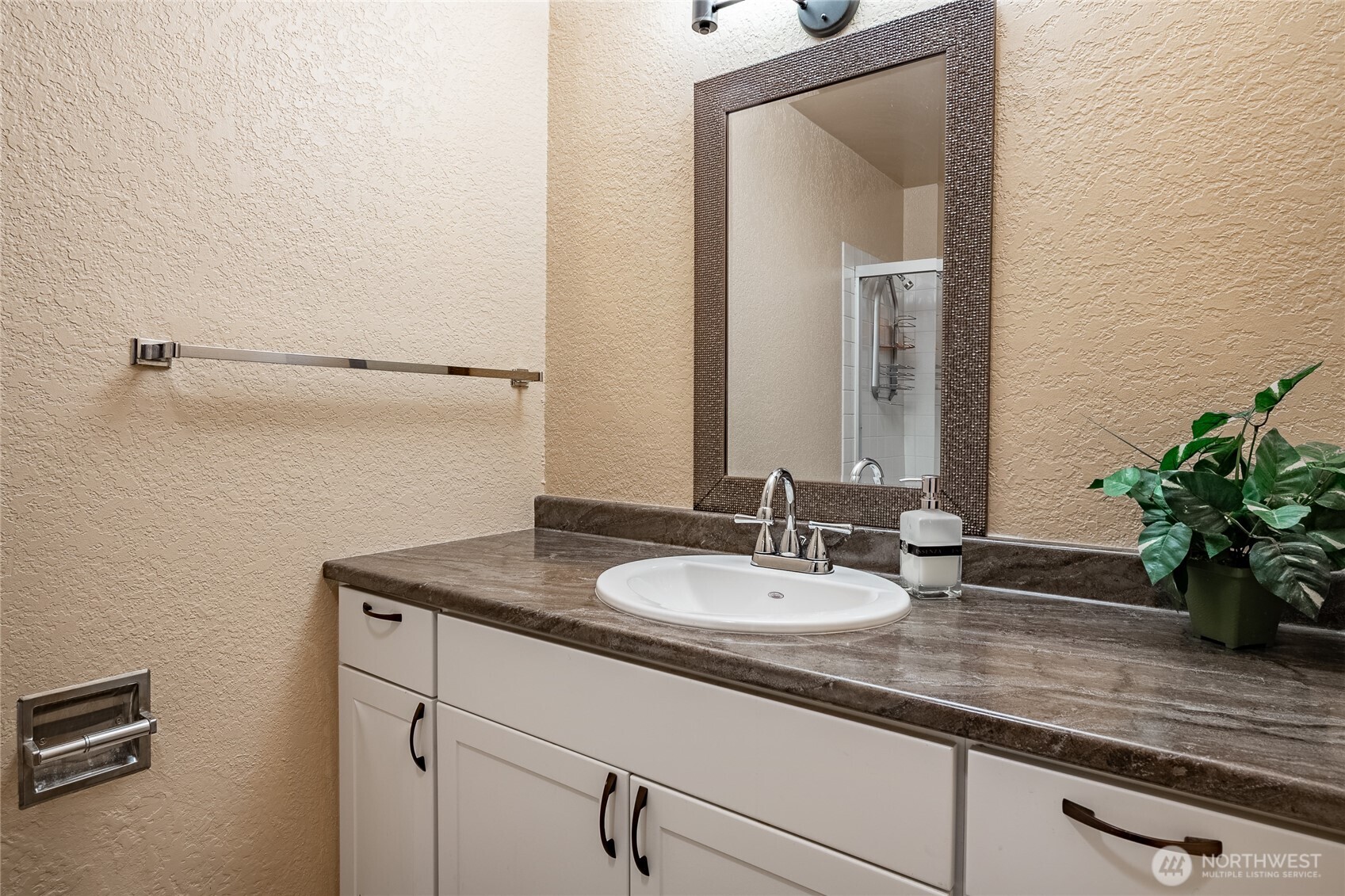 7018 Olympus Way Glacier, WA 98244 - Photo 19 of 35 a bathroom with a sink and a mirror