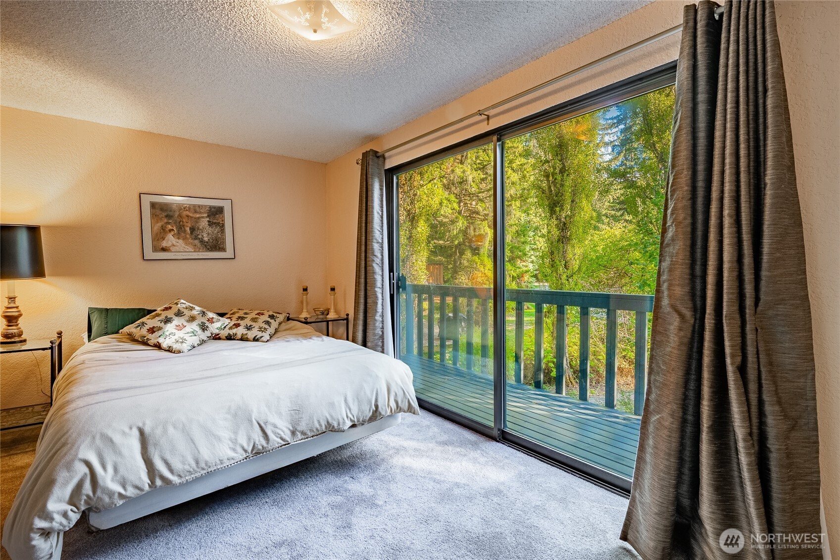 7018 Olympus Way Glacier, WA 98244 - Photo 22 of 35 a bedroom with a bed and a large window