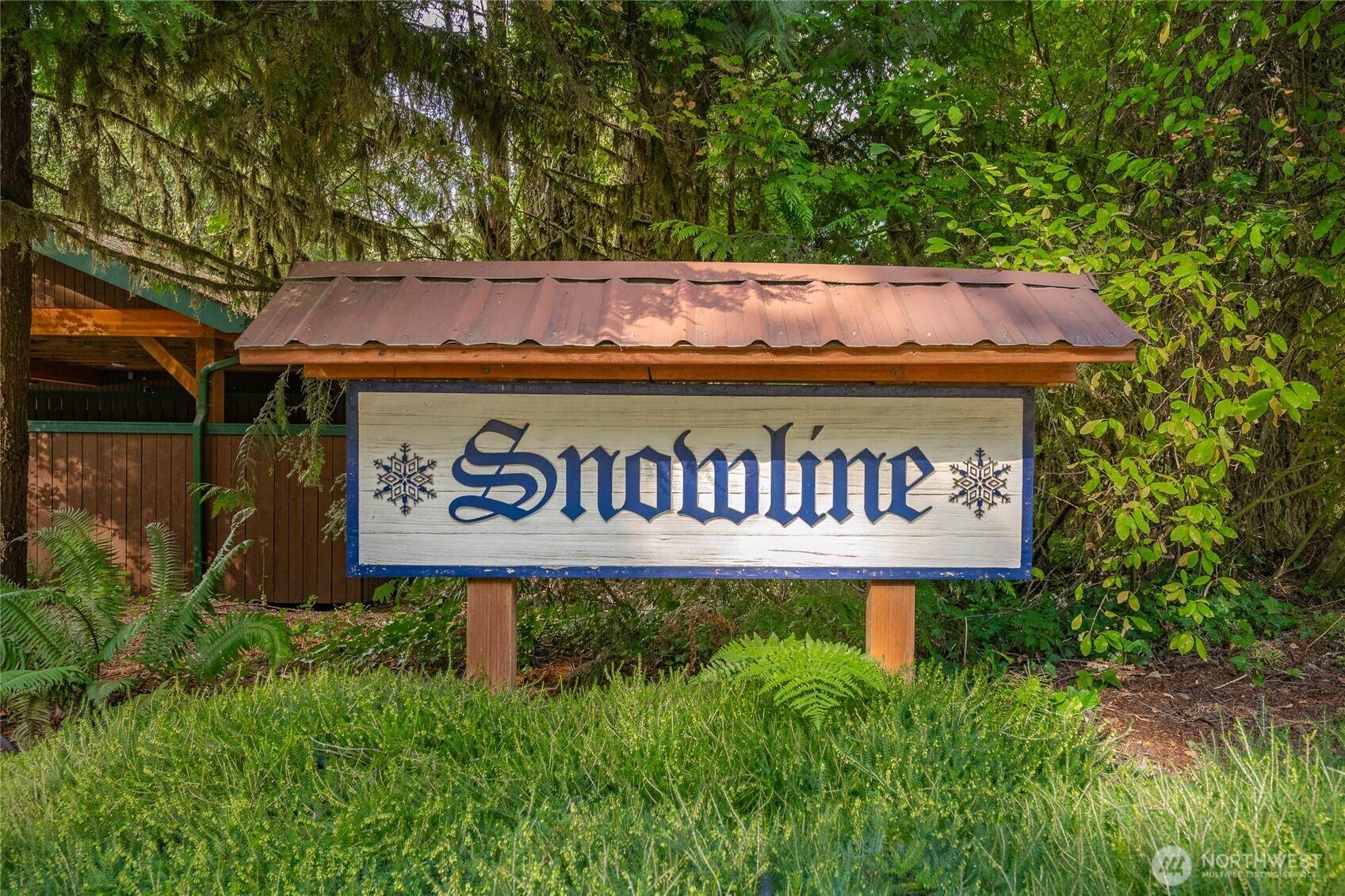 7018 Olympus Way Glacier, WA 98244 - Photo 35 of 35 a sign that is sitting on a brick wall