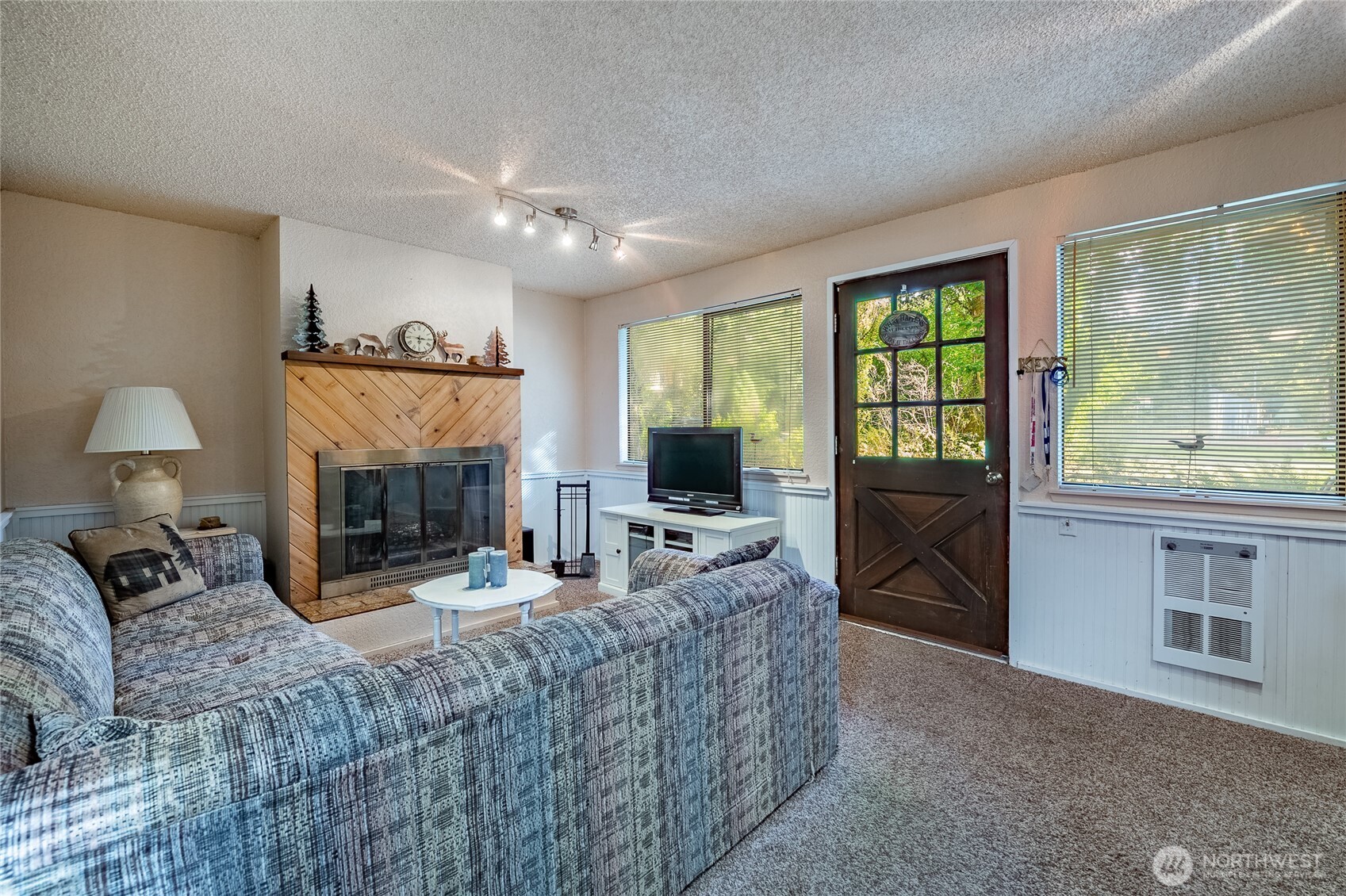 7018 Olympus Way Glacier, WA 98244 - Photo 5 of 35 a living room with furniture and a fireplace