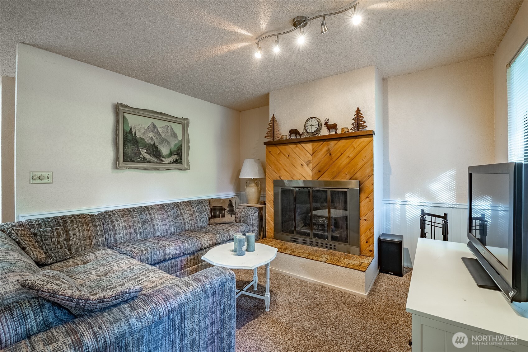 7018 Olympus Way Glacier, WA 98244 - Photo 7 of 35 a living room with furniture and a fireplace