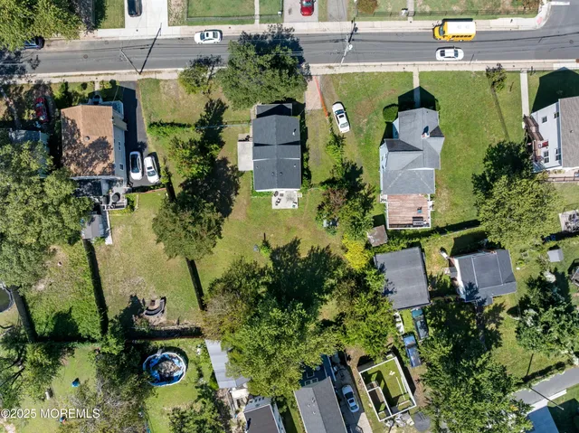 an aerial view of residential building and ocean