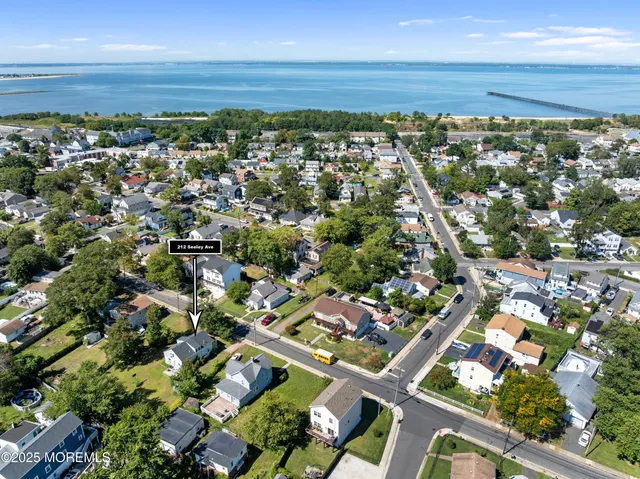 an aerial view of residential building and green space