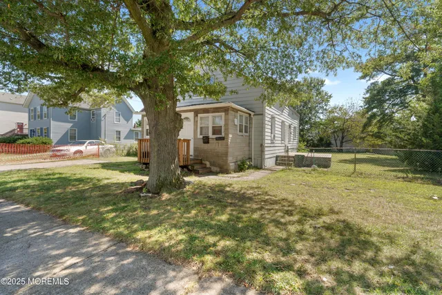 a house with trees in front of it