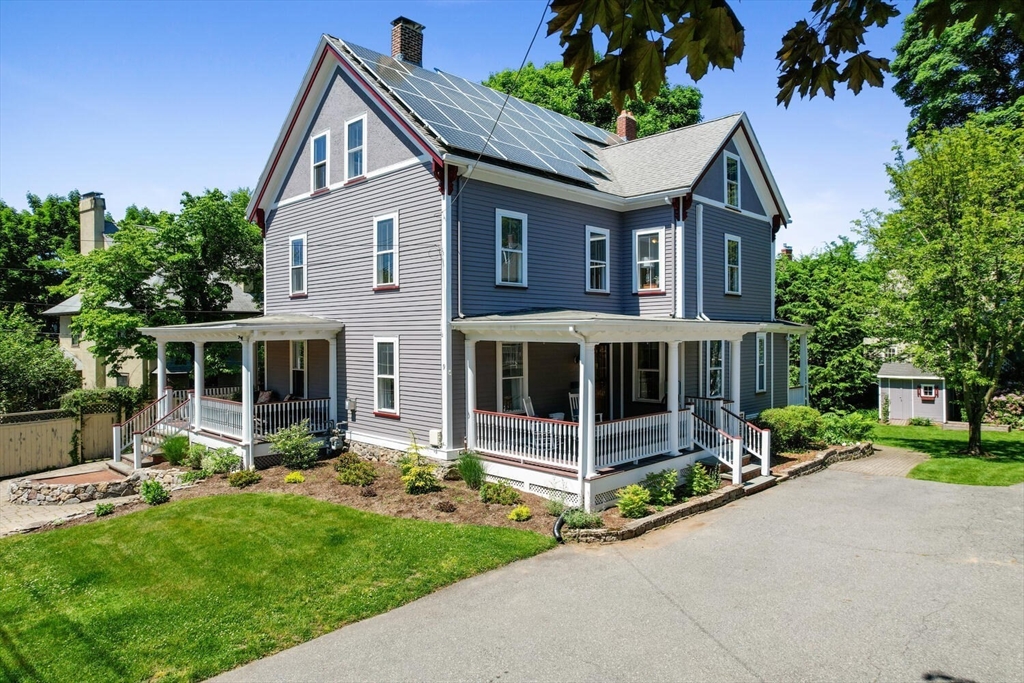 a view of a house with a yard and plants