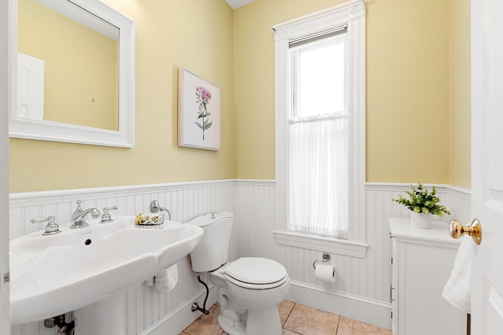 9 Bacon Street, Unit 9 Winchester, MA 01890 - Photo 14 of 35 a bathroom with a sink and a toilet