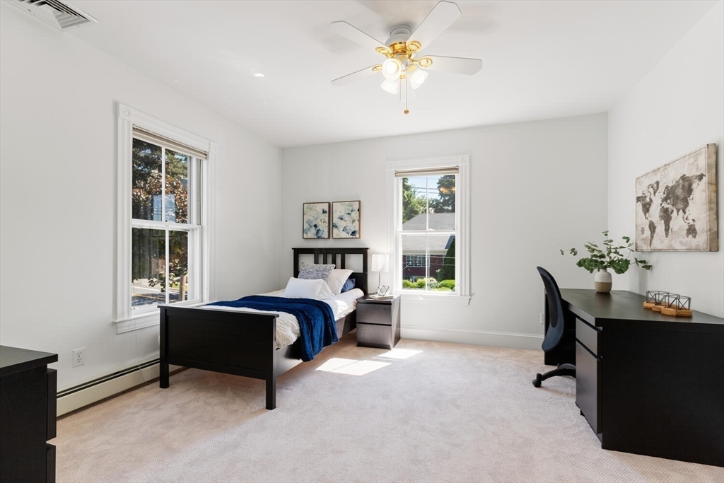 9 Bacon Street, Unit 9 Winchester, MA 01890 - Photo 17 of 35 a bedroom with furniture and a window