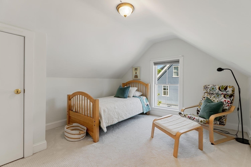 9 Bacon Street, Unit 9 Winchester, MA 01890 - Photo 19 of 35 a bedroom with furniture and a window