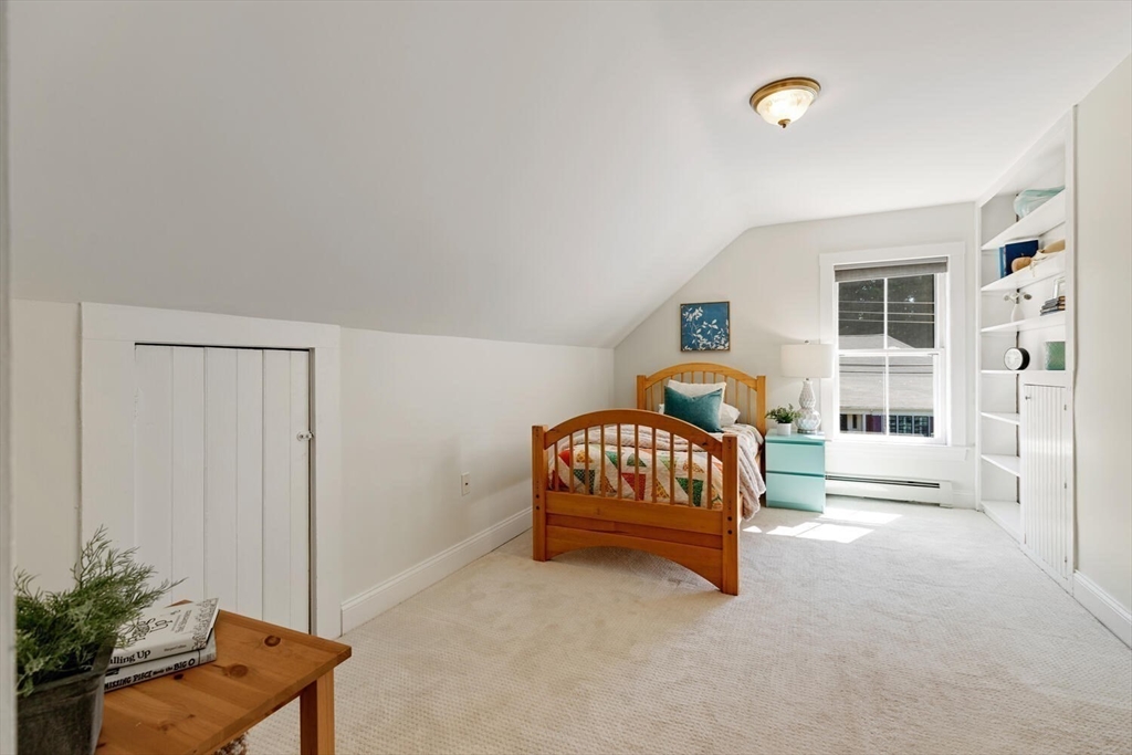 9 Bacon Street, Unit 9 Winchester, MA 01890 - Photo 20 of 35 a bedroom with furniture and a window
