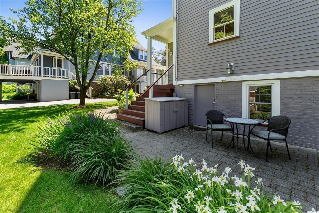 9 Bacon Street, Unit 9 Winchester, MA 01890 - Photo 29 of 35 a view of a house with backyard and sitting area