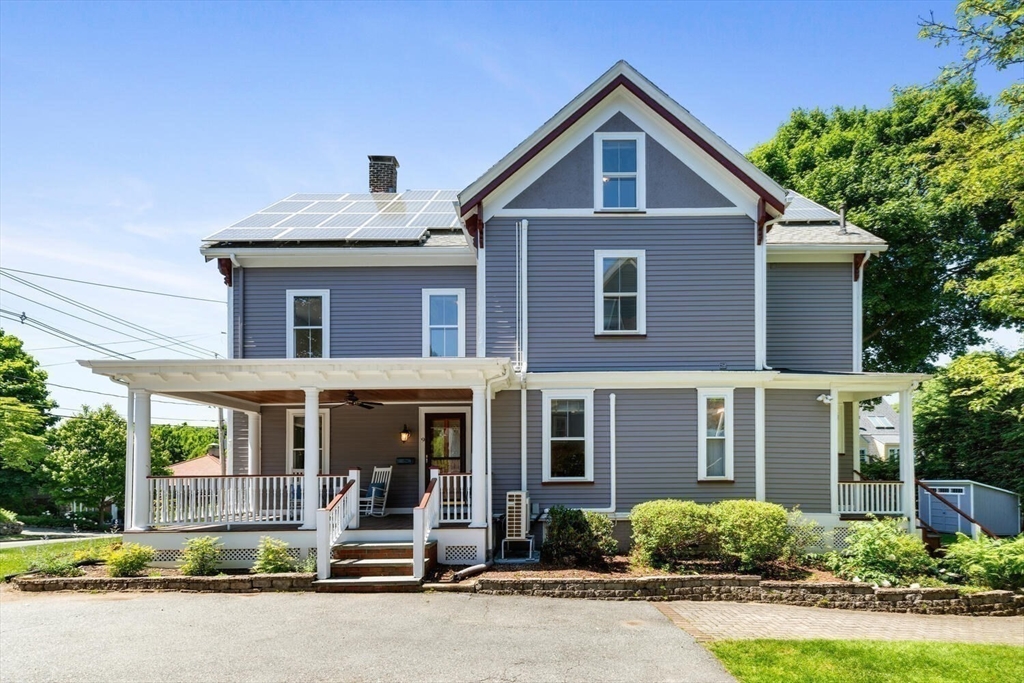 9 Bacon Street, Unit 9 Winchester, MA 01890 - Photo 35 of 35 a front view of a house with a yard