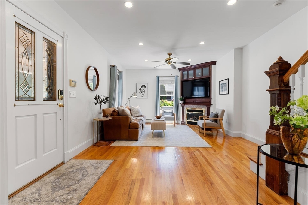 9 Bacon Street, Unit 9 Winchester, MA 01890 - Photo 5 of 35 a living room with furniture and a flat screen tv