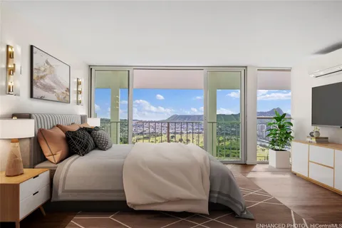 a spacious bedroom with a large bed and a large window