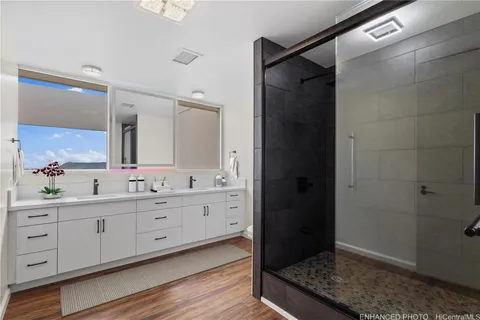 a living room with furniture and wooden floors
