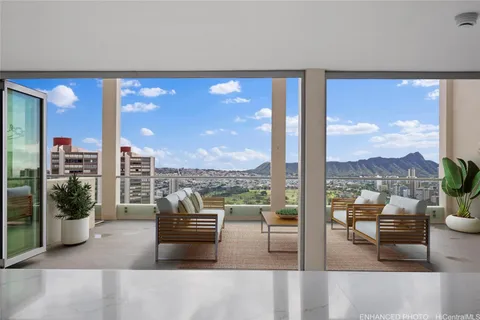 a spacious bedroom with two beds and a couch