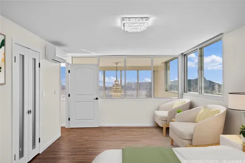 a view of living room with furniture and potted plant