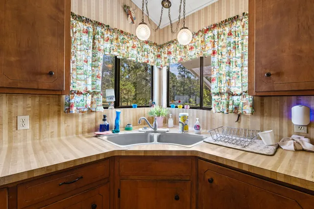 a kitchen with a sink and a window