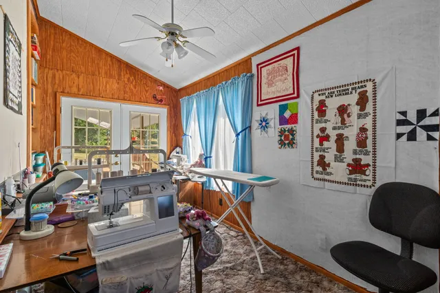a view of a livingroom with furniture hardwood floor and a window