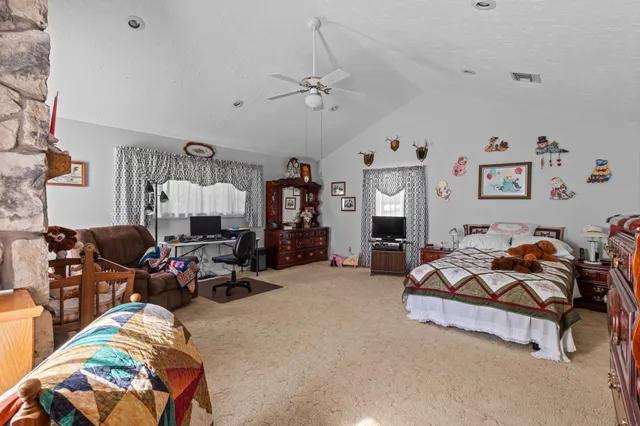a bedroom with furniture and a gym equipment