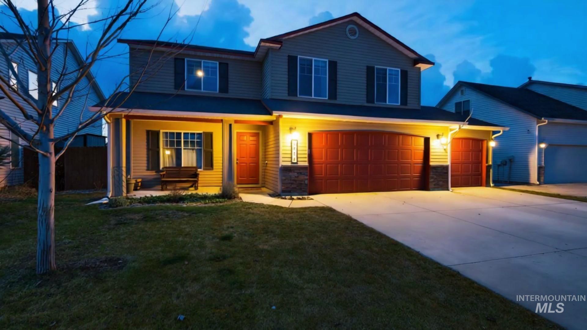 5414 Barkley Way Caldwell, ID 83607 - Photo 1 of 50 View of front facade featuring driveway, covered porch, stone siding, and an attached garage