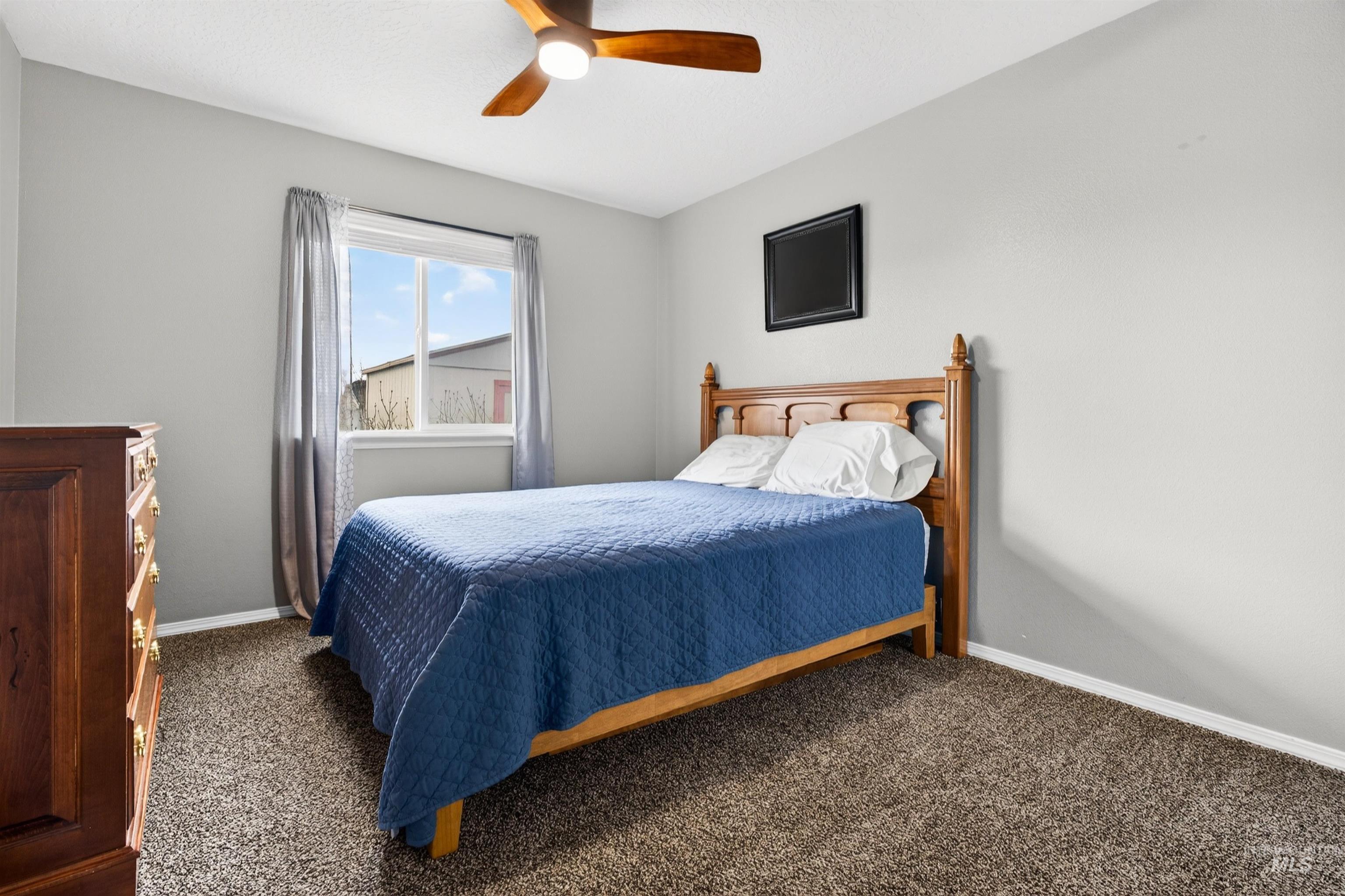 5414 Barkley Way Caldwell, ID 83607 - Photo 25 of 50 Carpeted bedroom featuring baseboards and a ceiling fan