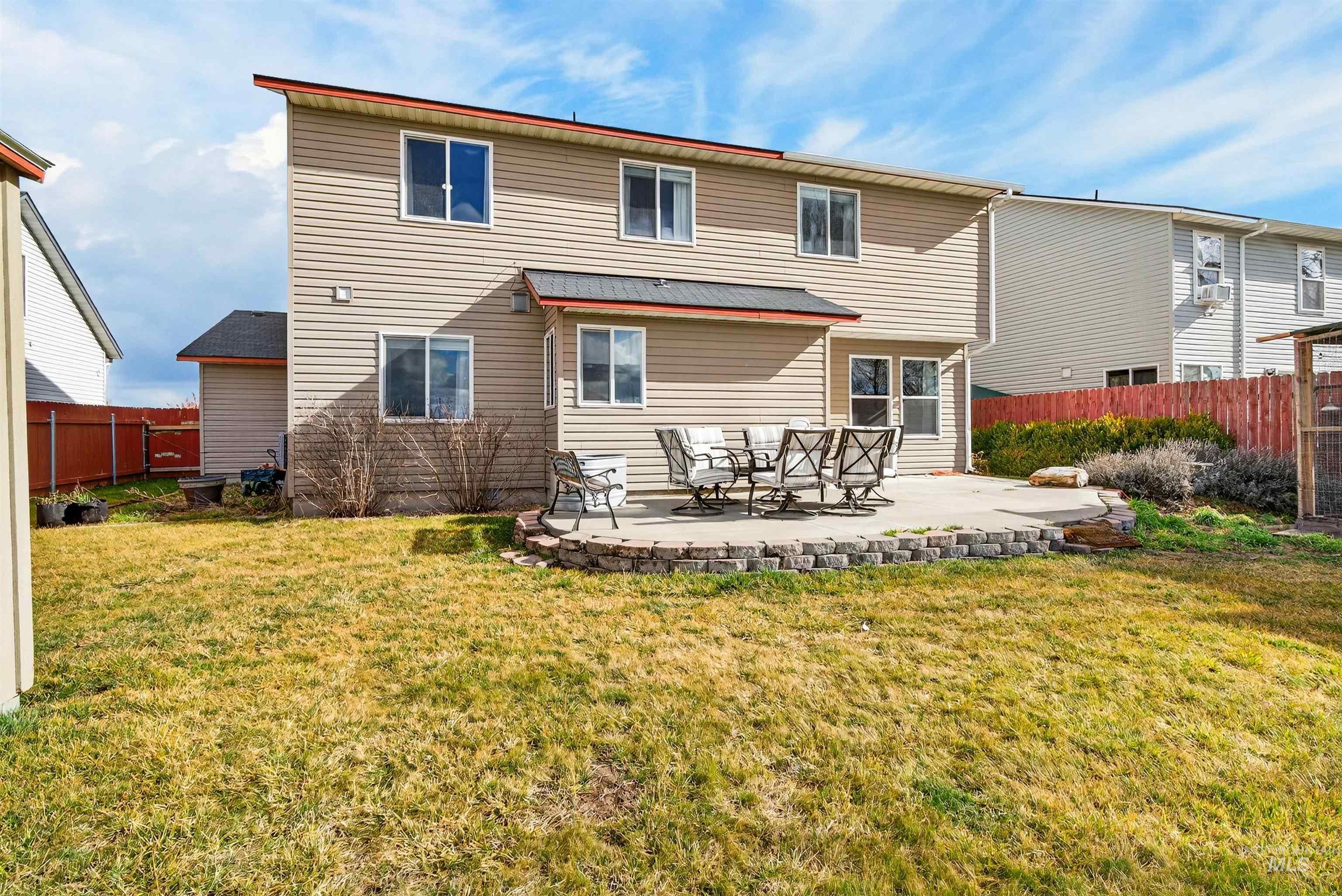 5414 Barkley Way Caldwell, ID 83607 - Photo 32 of 50 Back of property featuring a fenced backyard and a patio area