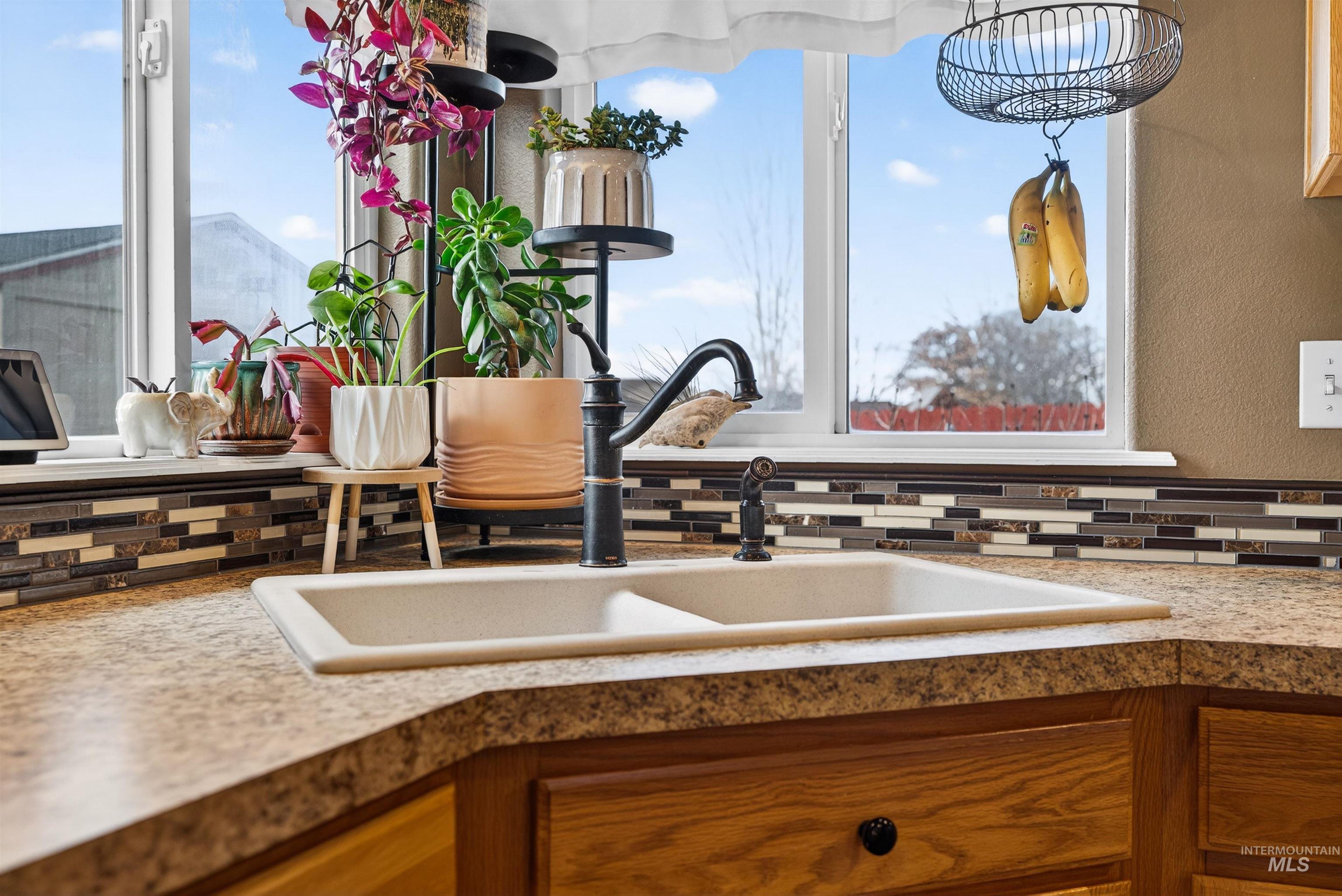 5414 Barkley Way Caldwell, ID 83607 - Photo 10 of 50 Kitchen view of wood finish cabinets and light countertops