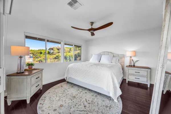 a bedroom with a bed and a table