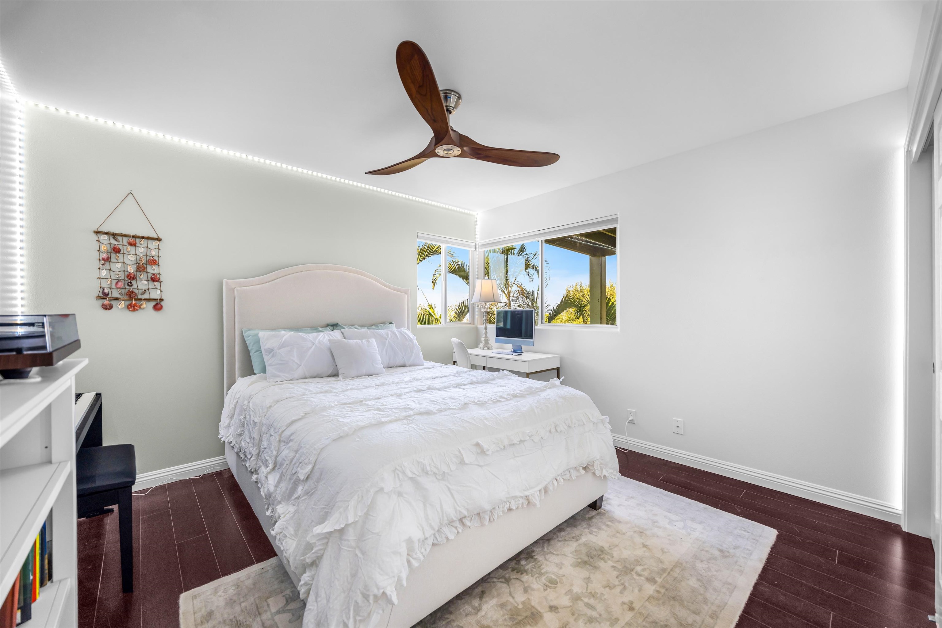 40 Kapalulu Place Kula, HI 96790 - Photo 21 of 45 a bedroom with a bed and a chandelier