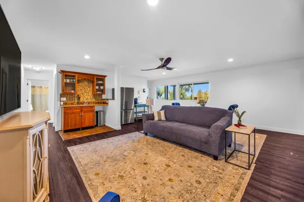 a living room with furniture and a rug