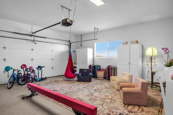 a bedroom with furniture and a chandelier