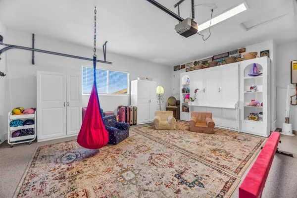 a bed room with a bed and a wooden floor