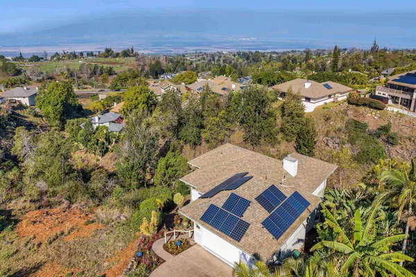 an aerial view of residential house with outdoor space and river view