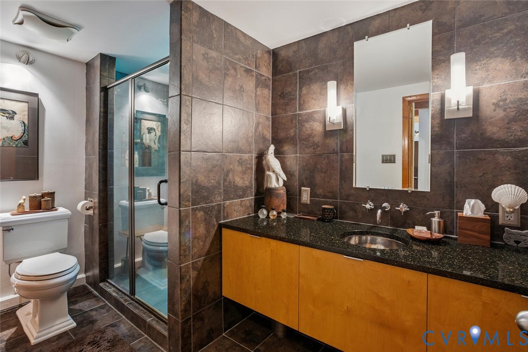 1474 Timber Ridge Maidens, VA 23102 - Photo 11 of 19 a bathroom with a double vanity sink toilet and shower