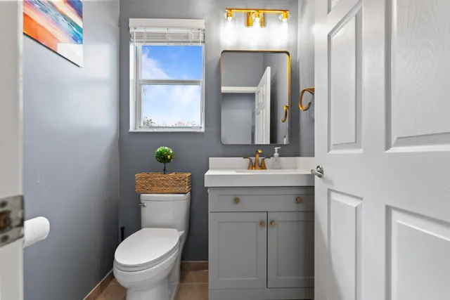 a kitchen with stainless steel appliances a sink stove and refrigerator