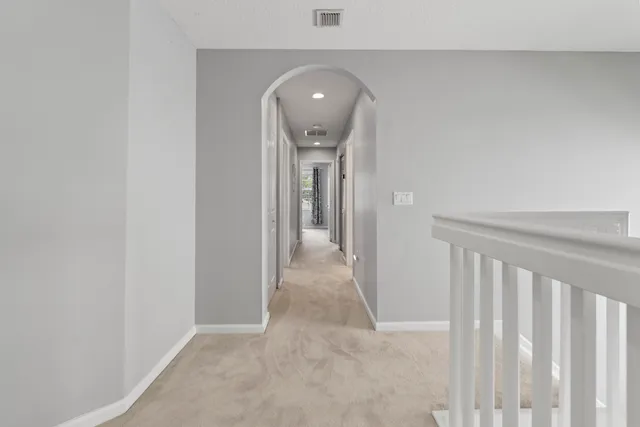a view of walk in closet with clothes