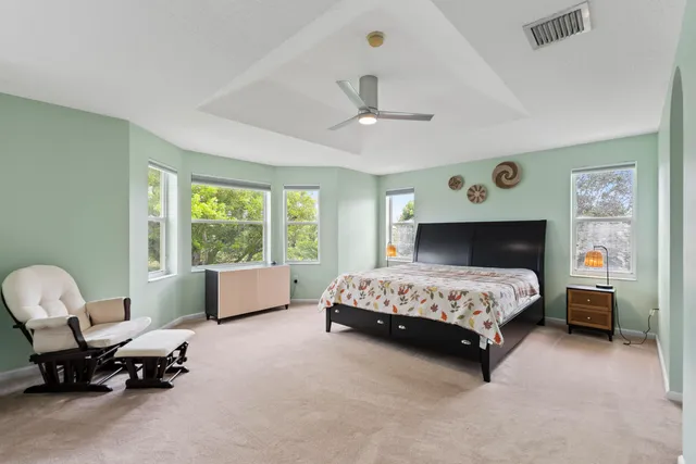 a bathroom with a double vanity sink a mirror and a shower